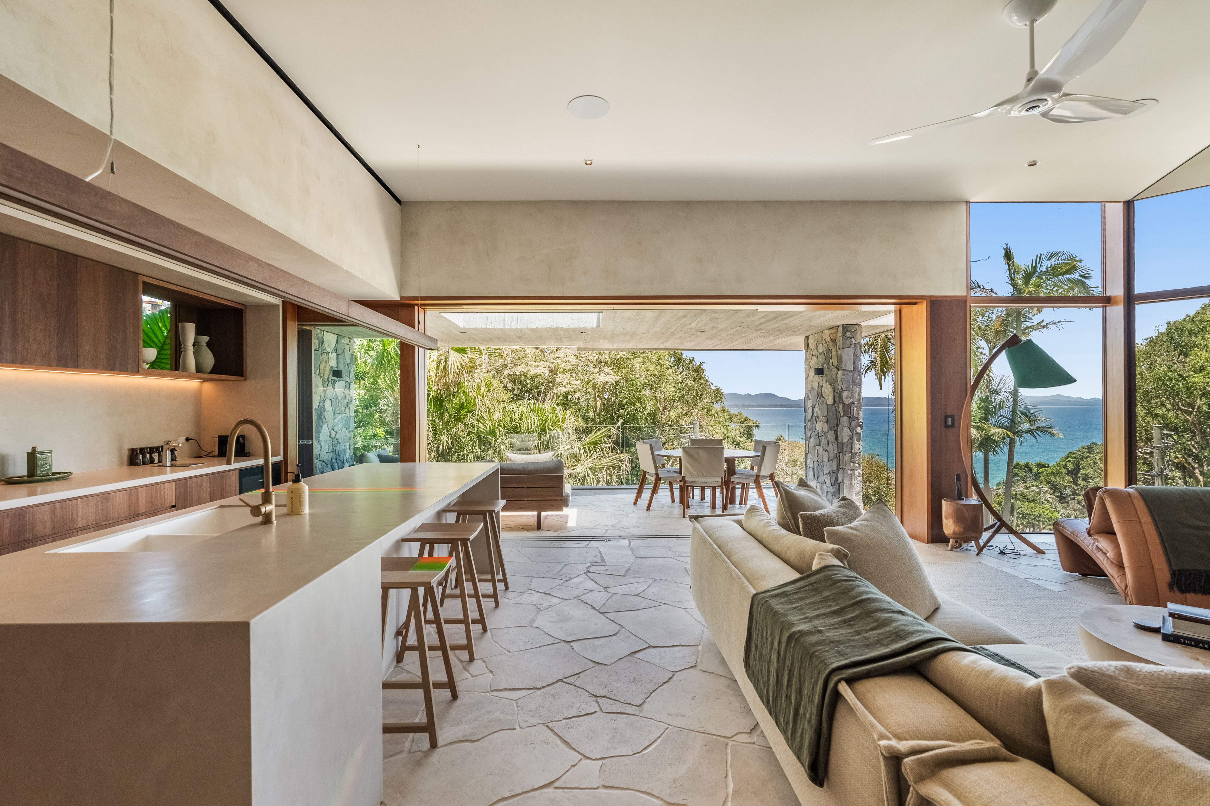 Open-plan kitchen and living with ocean views — interior real estate photography Byron Bay