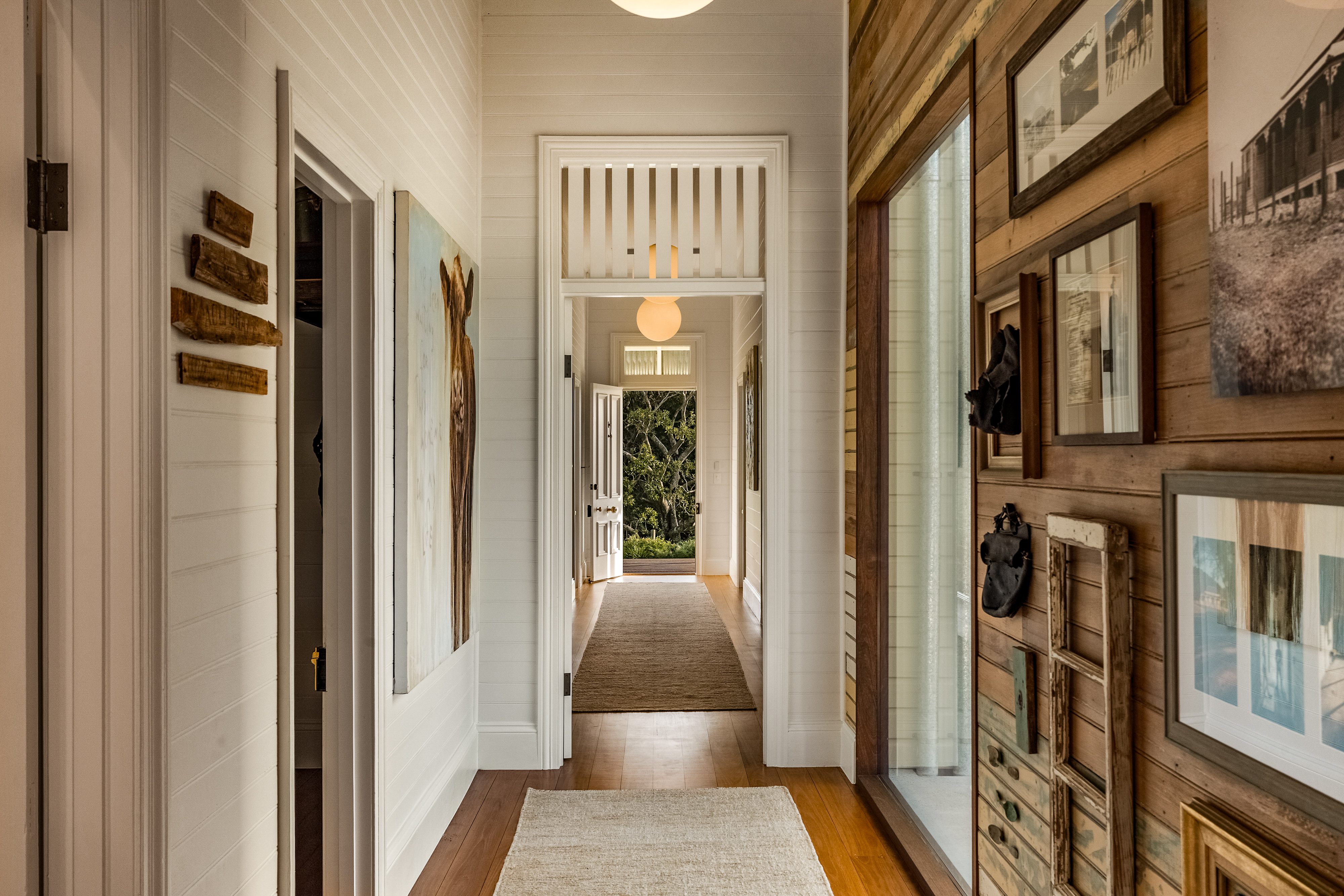 Heritage hallway with bespoke history wall and original timber panelling