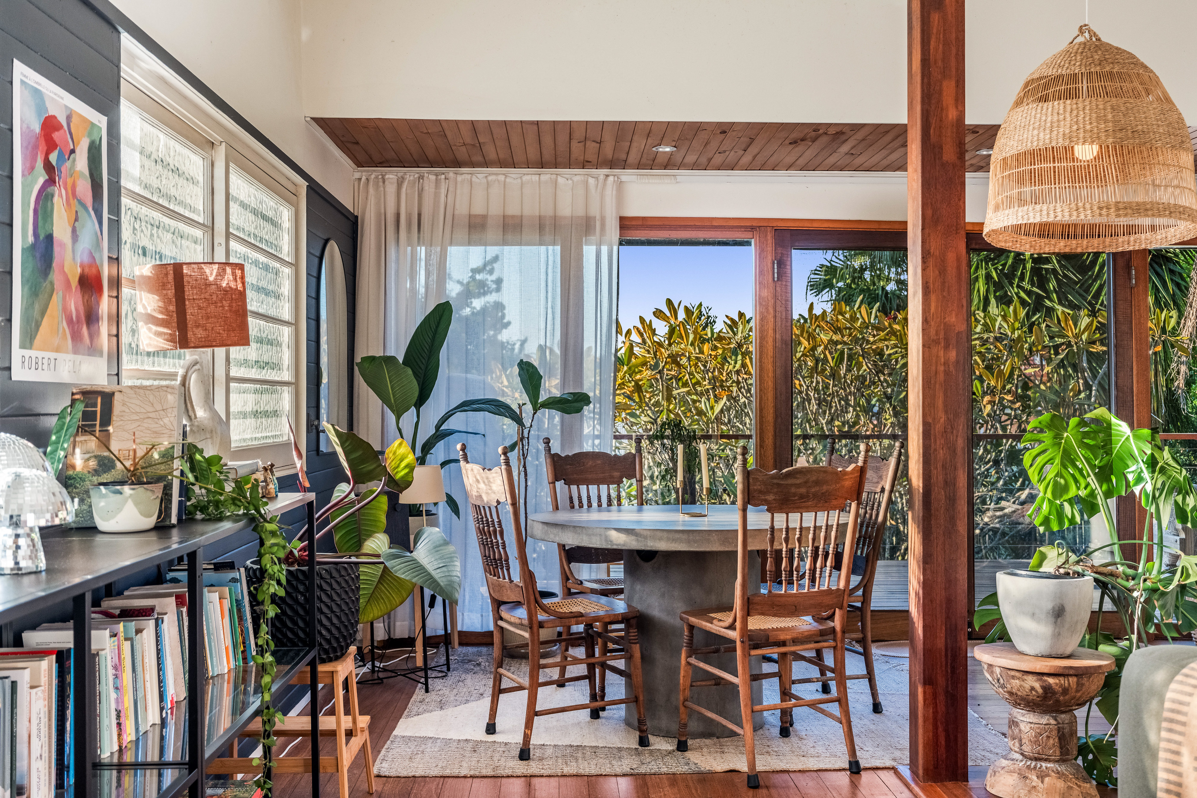 Dining area with timber post and garden views