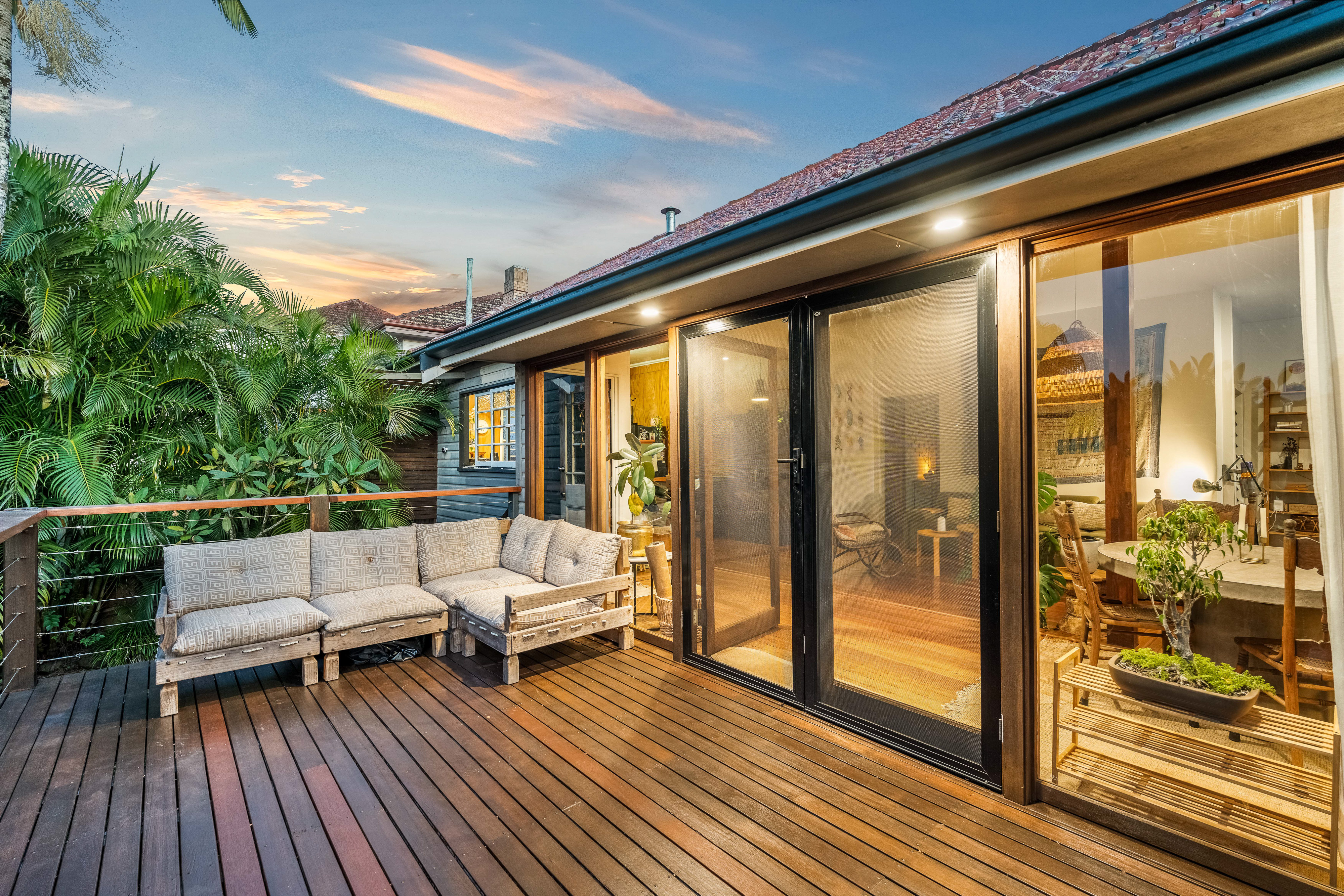 Timber deck with outdoor lounge at golden hour