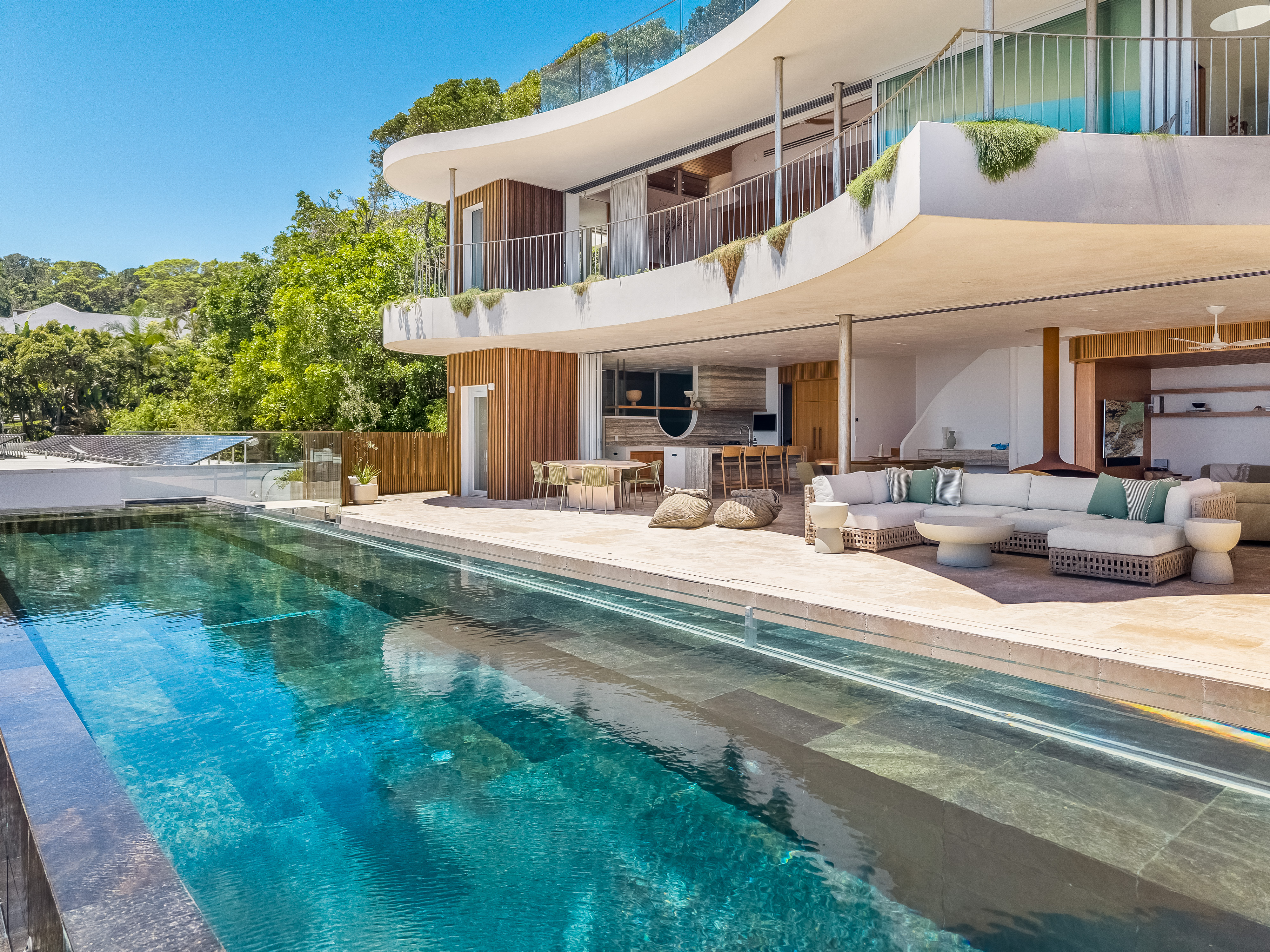 Pool level with outdoor lounge — luxury property photography, Byron Bay
