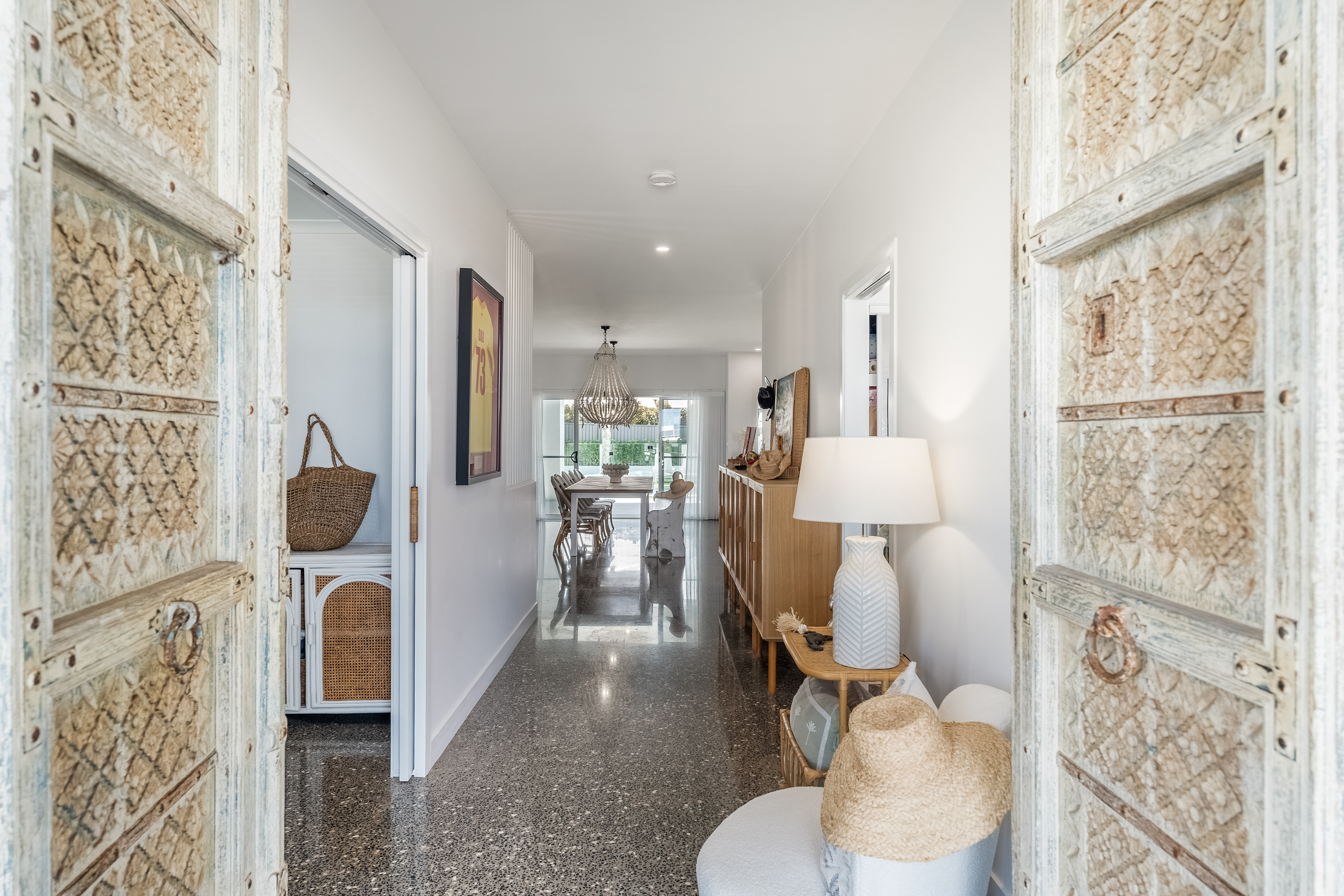 Entry hallway with carved timber doors — interior real estate photography Ballina