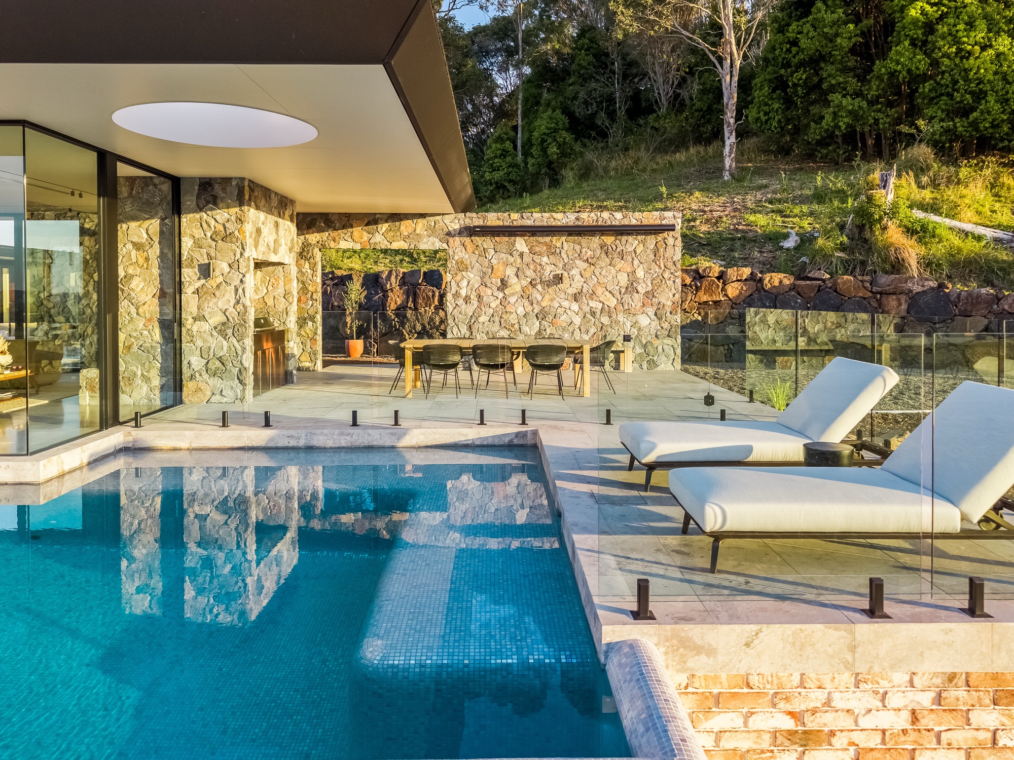 Pool and sun lounges with hinterland views