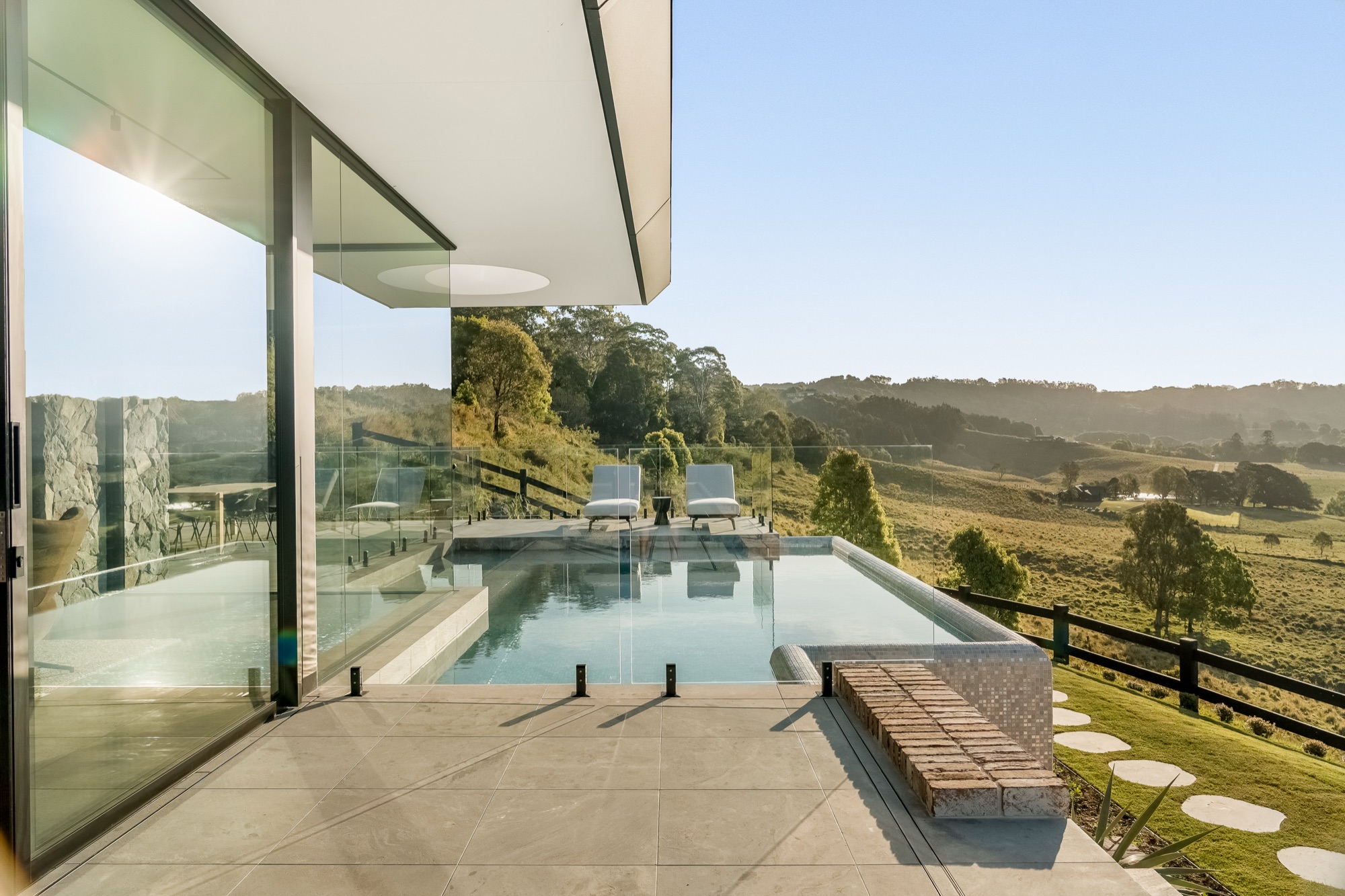 Pool from living room showing seamless indoor-outdoor connection
