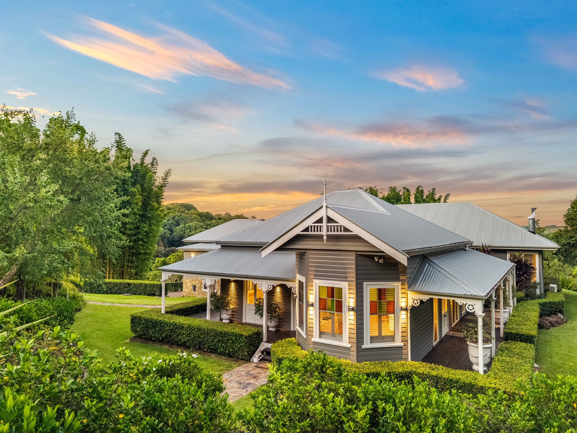 Heritage gable and verandah at twilight with coloured sky