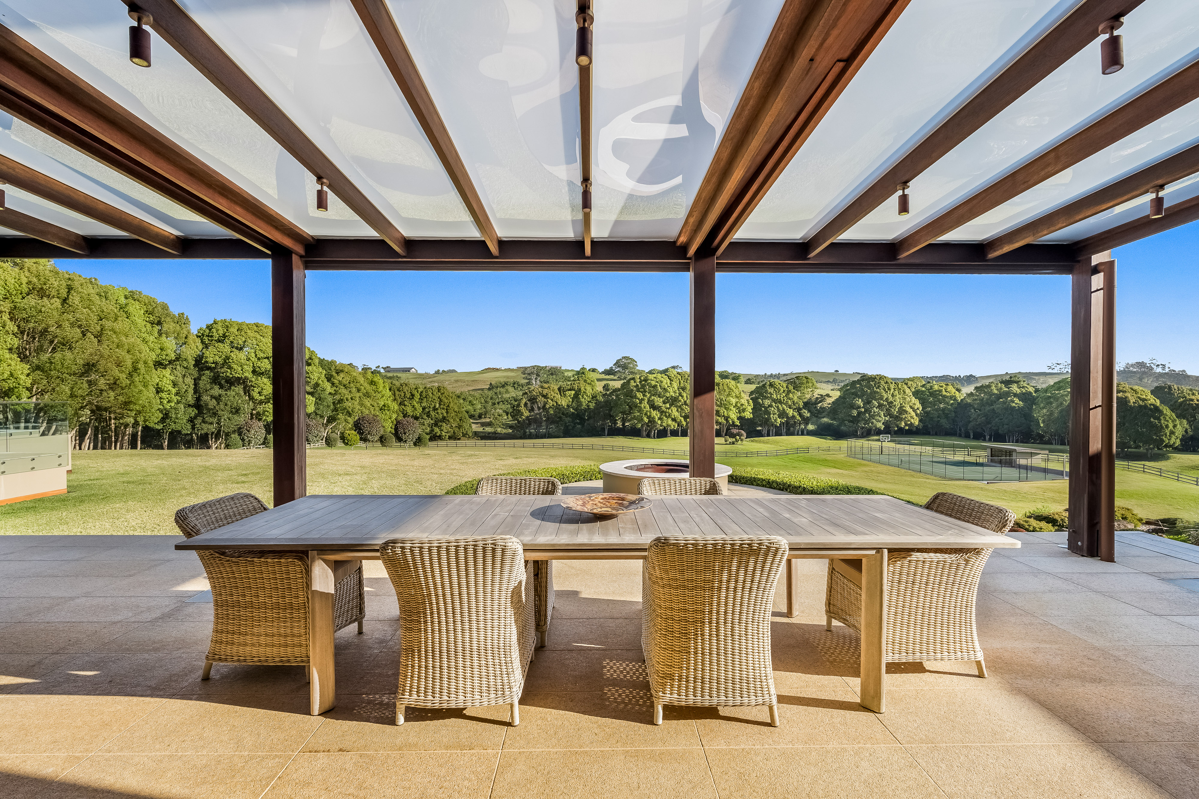 Covered alfresco dining with hinterland views — professional property photography Talofa