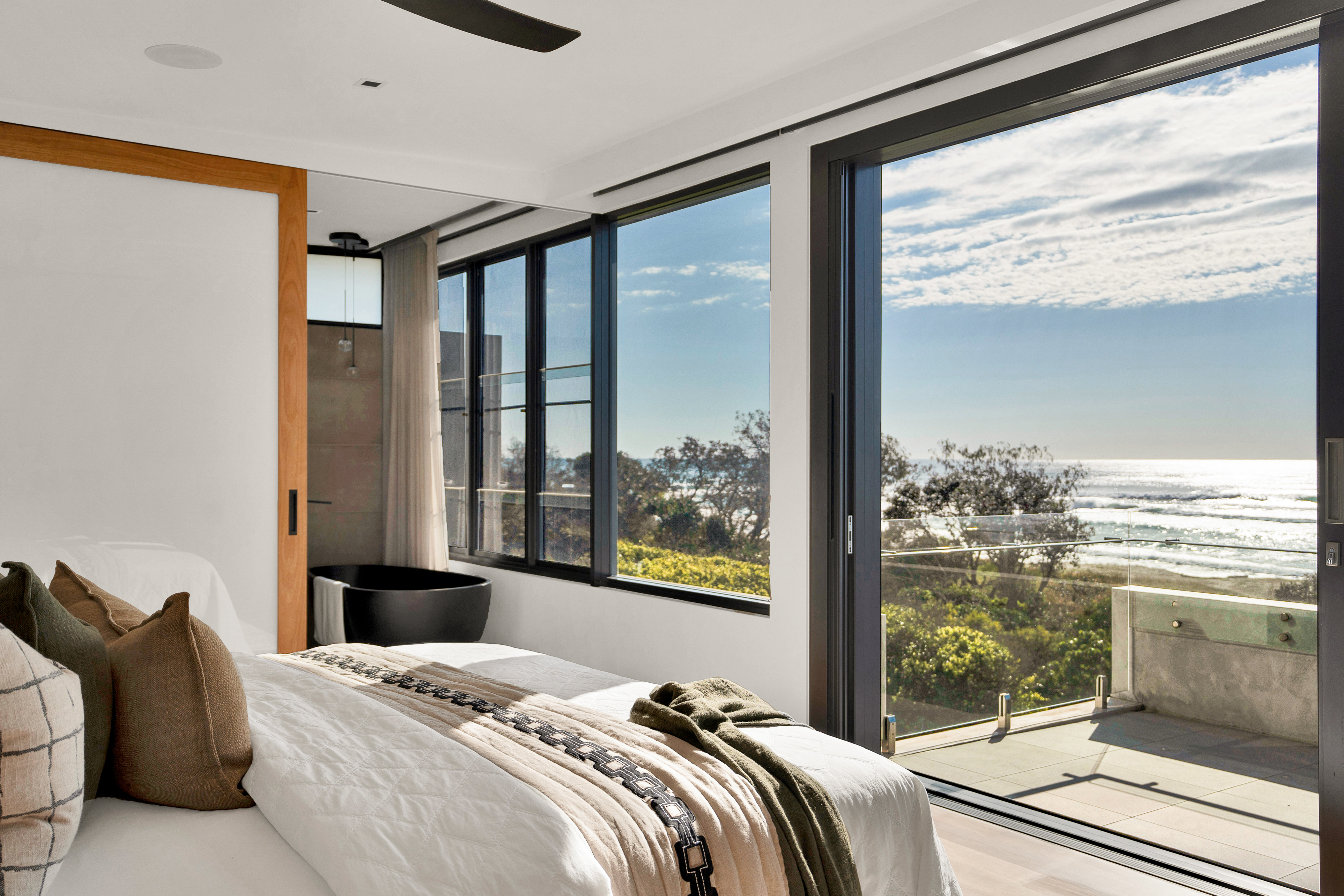 Master bedroom with ocean views and ensuite — real estate photography Hastings Point