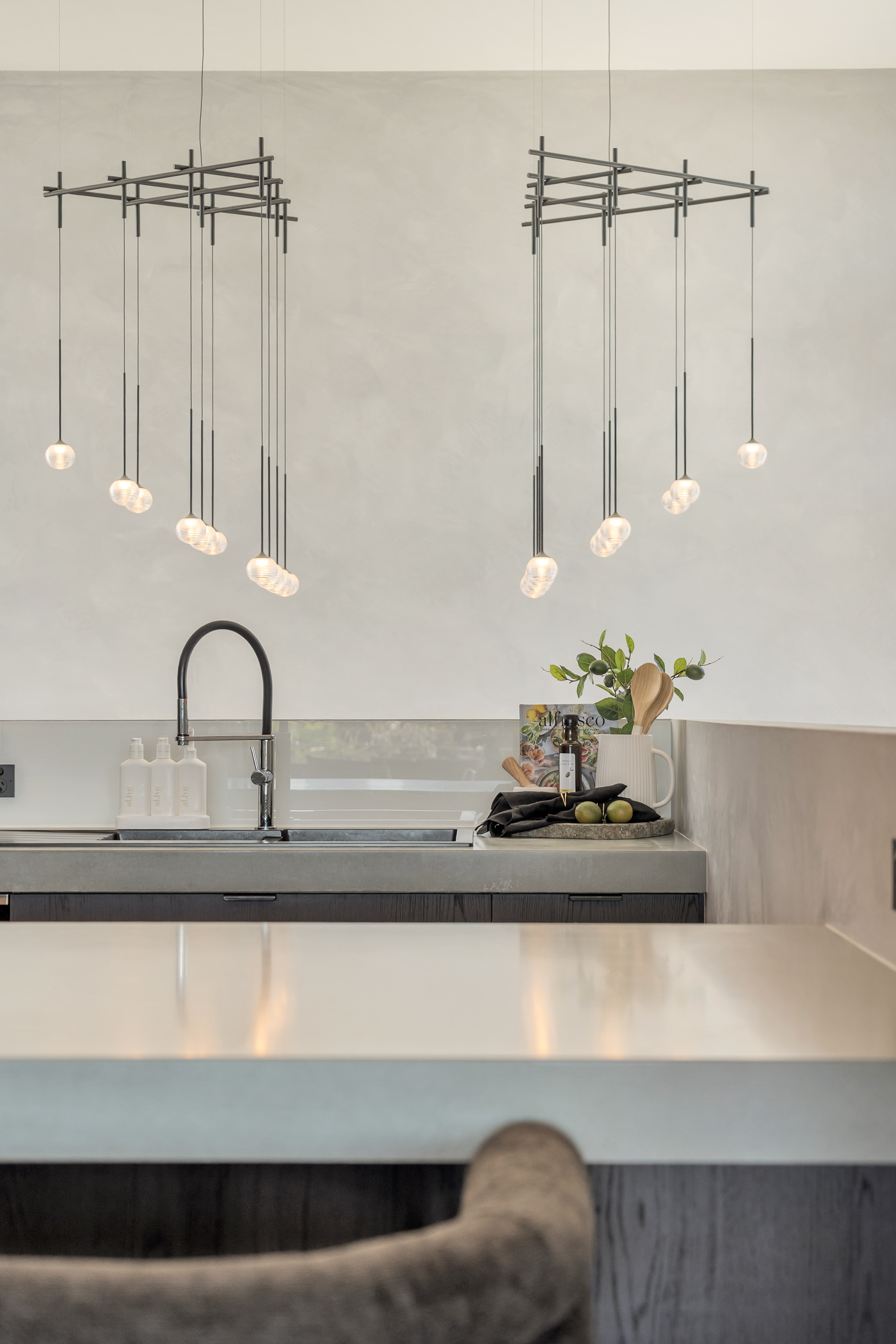 Kitchen detail with designer pendant lights — interior property photography