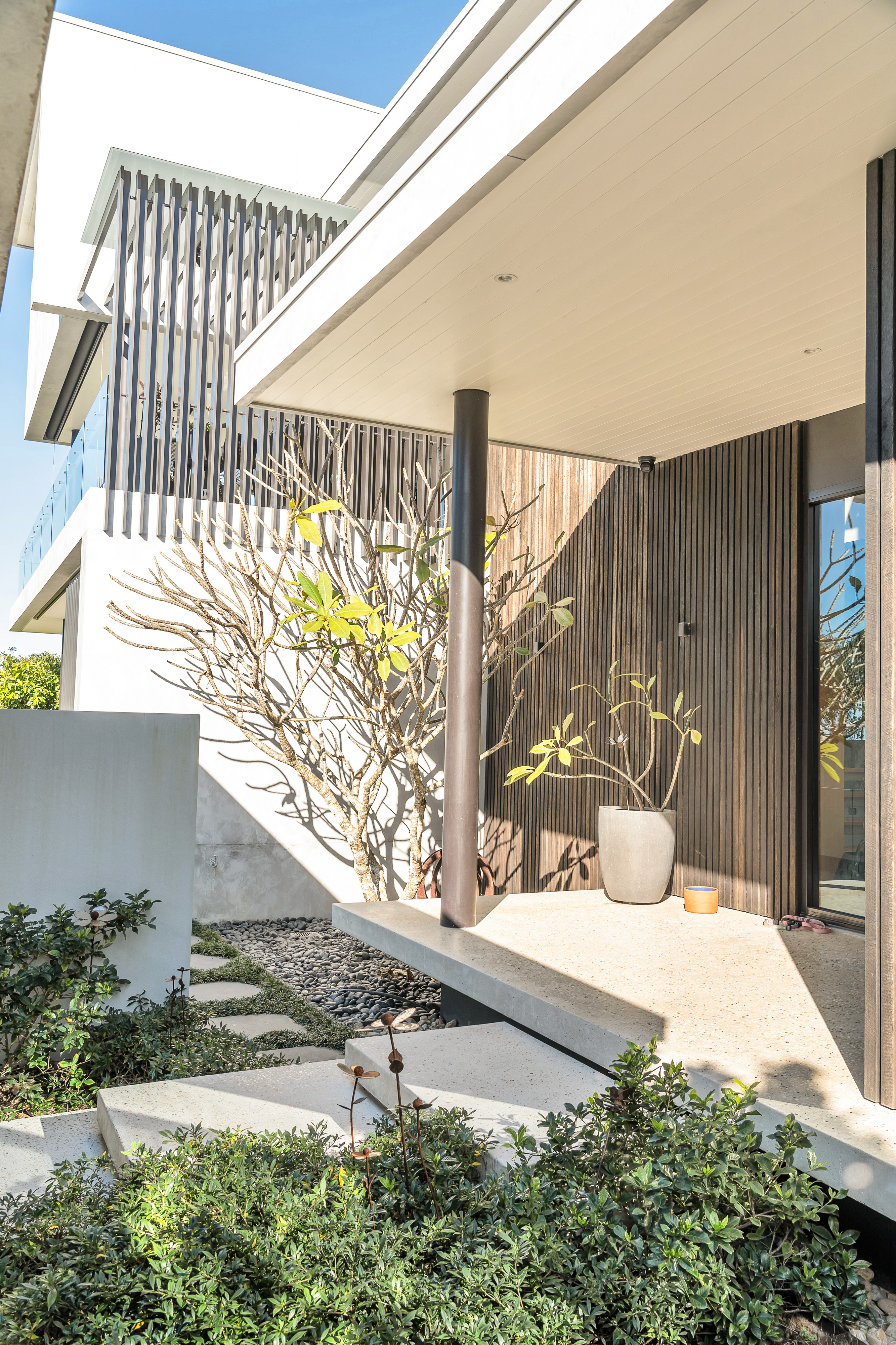 Entry courtyard with landscaping — architectural property photography