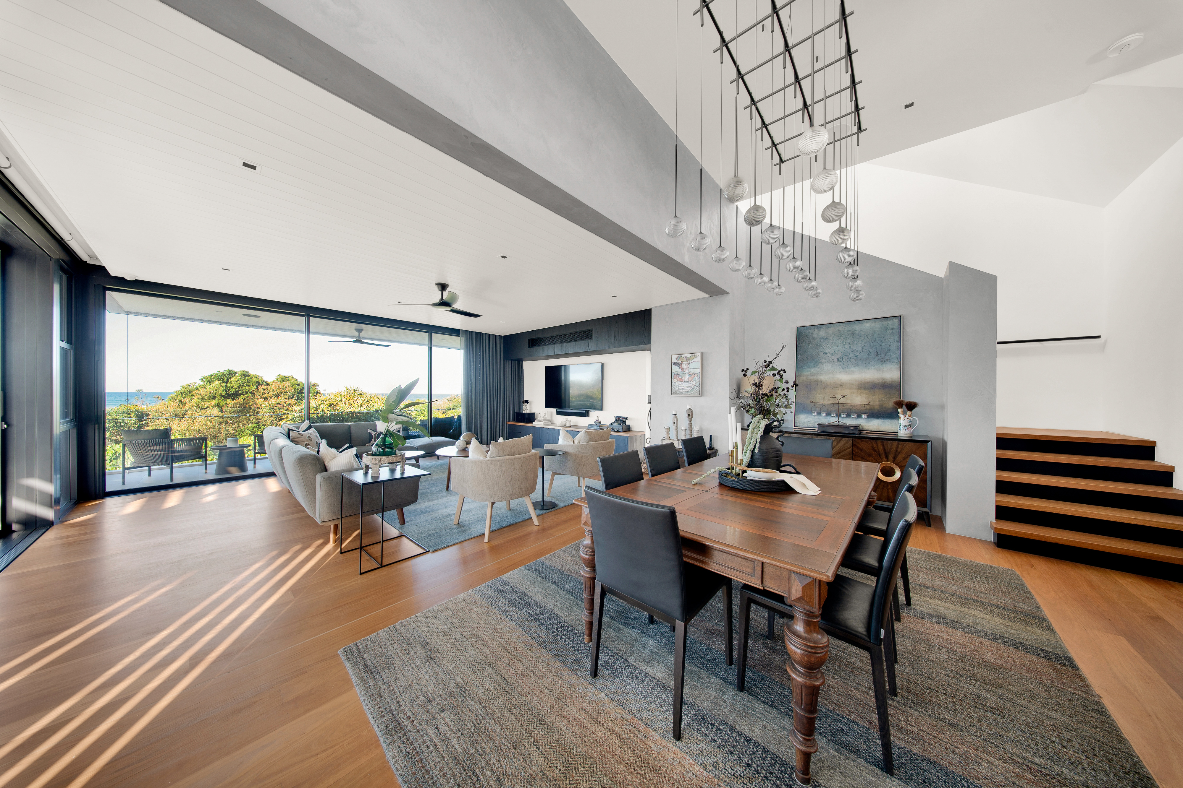 Open-plan living and dining with ocean views — interior real estate photography Hastings Point